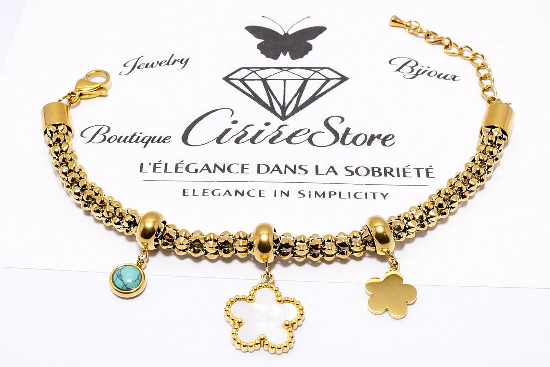 Bracelet à breloques – acier inoxydable – finition dorée – trèfle et pendentif bleu/turquoise