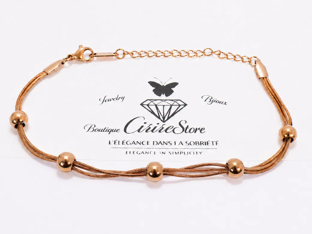 Multi-strand gold bracelet with round beads