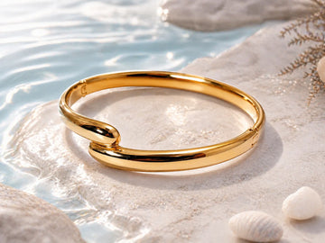 Bracelet jonc doré à embouts croisés
