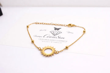 Bracelet doré avec motif soleil ajouré