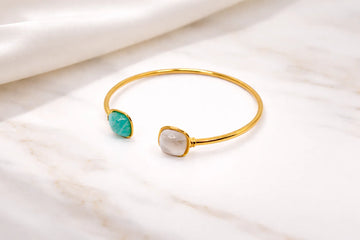 Gold-plated bangle with two decorative stones
