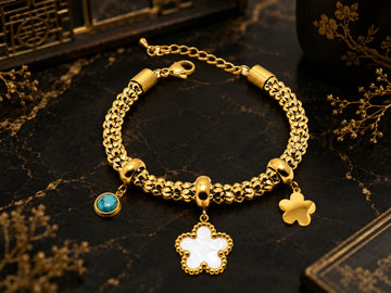 Bracelet à breloques – acier inoxydable – finition dorée – trèfle et pendentif bleu/turquoise